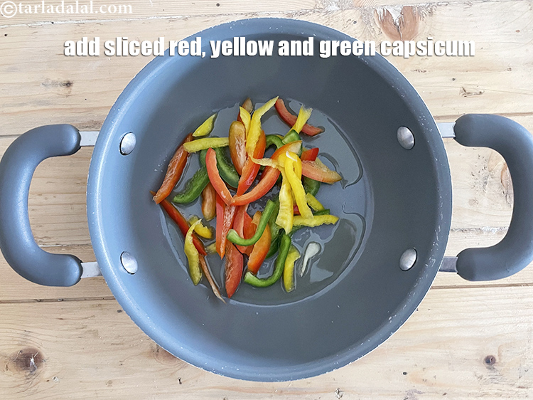 Step 7 – Add&nbsp;<meta charset="UTF-8" />1/2 cup&nbsp;sliced capsicum (<a href="glossary-sliced-red-capsicum-2176i">red</a>&nbsp;,&nbsp;&nbsp;<a href="glossary-sliced-yellow-capsicum-2178i">yellow</a>&nbsp;and&nbsp;<a href="glossary-sliced-capsicum-165i">green</a>).
