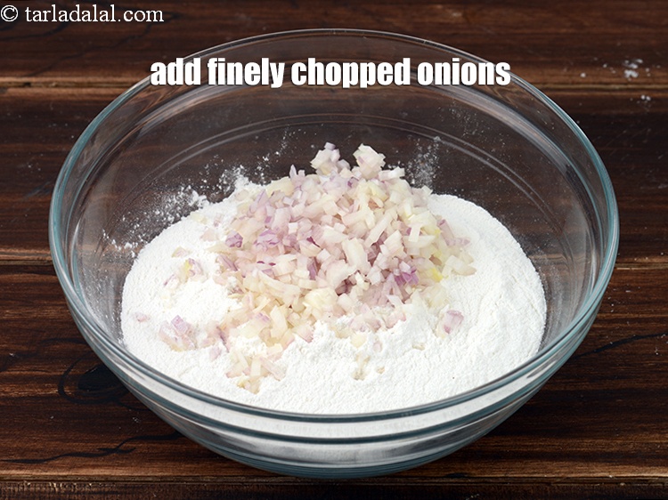 Step 4 – Add 1/2 cup finely <a href="https://www.tarladalal.com/glossary-chopped-onions-722i">chopped onions</a>.