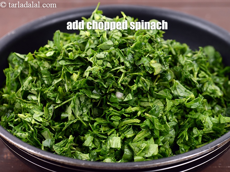 Step 4 – Add 5 cups <a href="https://www.tarladalal.com/glossary-chopped-spinach-780i">chopped spinach (palak)</a>.