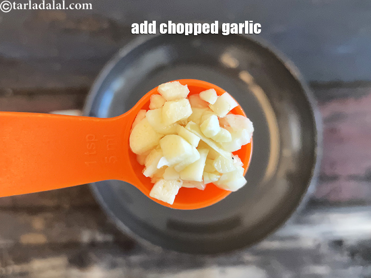 Step 8 – Add&nbsp;<meta charset="UTF-8" />1 tsp&nbsp;finely&nbsp;<a href="glossary-chopped-garlic-790i">chopped garlic (lehsun)</a>.