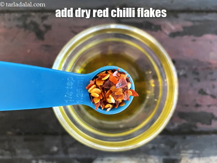 Step 15 – Add&nbsp;1/4 tsp&nbsp;<a href="glossary-dry-red-chilli-flakes-paprika-338i">dry red chilli flakes (paprika)</a>.