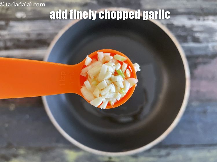 Step 10 – Add&nbsp;2 tsp&nbsp;finely&nbsp;<a href="glossary-chopped-garlic-790i">chopped garlic (lehsun)</a>.