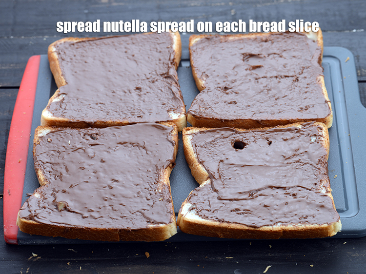 Step 4 – Spread &frac34; tbsp of <a href="https://www.tarladalal.com/glossary-nutella-1288i">nutella spread</a> on each bread slice.