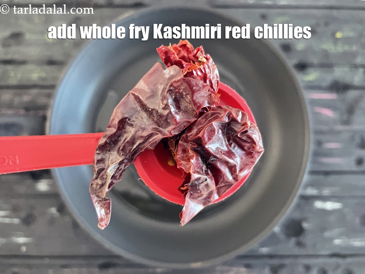Step 23 – Add&nbsp;<meta charset="UTF-8" />2&nbsp;whole&nbsp;<a href="glossary-whole-dry-kashmiri-red-chillies-kashmiri-mirch-kashmiri-lal-mirch-332i">dry kashmiri red chillies</a>, broken into pieces.
