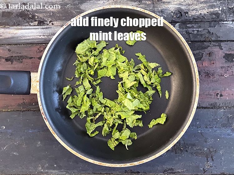 Step 9 – Add&nbsp;1/4 cup&nbsp;finely&nbsp;<a href="glossary-chopped-mint-788i">chopped mint leaves (phudina)</a>.
