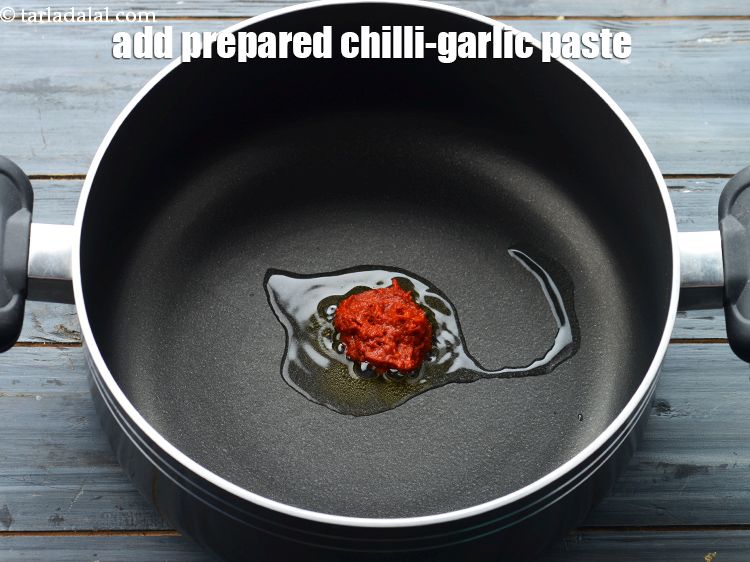 Step 11 – Add 1/4th of the prepared chilli-garlic paste. See recipe above how to make chilli garlic …