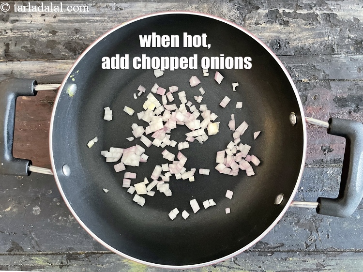 Step 5 – When hot, add 1/4 cup chopped onions.