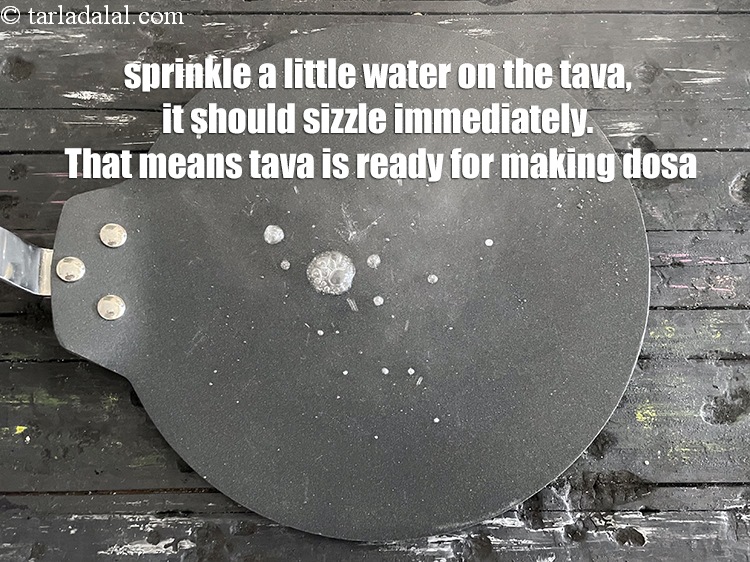 Step 66 – <meta charset="UTF-8" />Sprinkle a little water on the tava.&nbsp;It should sizzle immediately. Never use a …