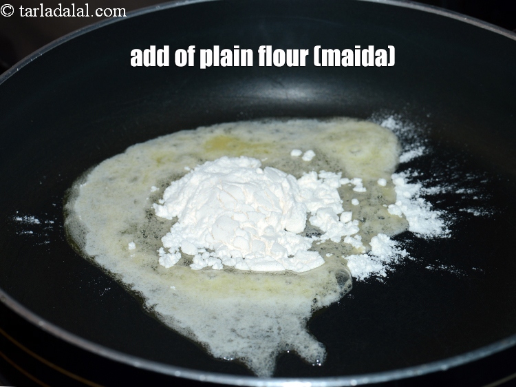 Step 4 – Add 1 1/4 tbsp of&nbsp;<a href="https://www.tarladalal.com/glossary-plain-flour-maida-188i">plain flour (maida)</a>. &nbsp;