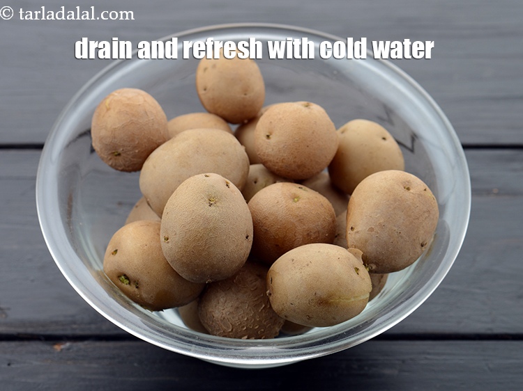 Step 4 – Drain the potatoes and discard the water. Refresh with cold water to prevent carry-over cooking.&nbsp;
