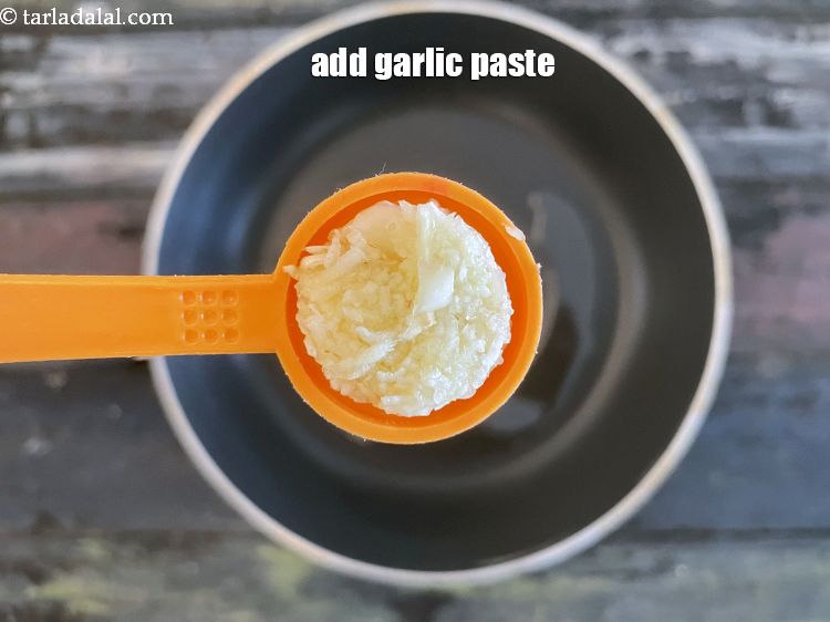 Step 11 – Add&nbsp;<meta charset="UTF-8" />1 tsp&nbsp;<a href="glossary-garlic-paste-lehsun-ki-paste-lahsun-ki-paste-350i">garlic (lehsun) paste</a>.
