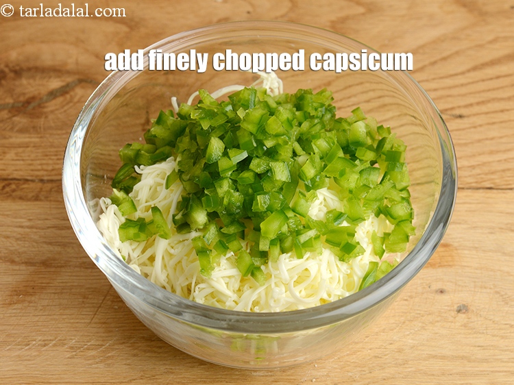 Step 4 – Add &frac12; cup finely <a href="https://www.tarladalal.com/glossary-chopped-capsicum-164i">chopped capsicum</a>.