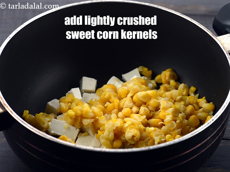 Step 4 – Add 1/2 cup&nbsp;<a href="https://www.tarladalal.com/glossary-boiled-and-crushed-sweet-corn-kernels-1930i">boiled and lightly crushed sweet corn kernels</a>. You can also add capsicum.