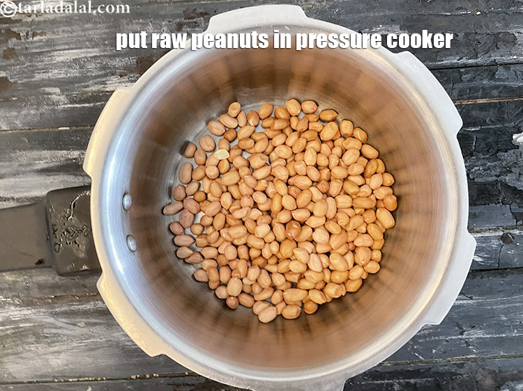 Step 7 – In a pressure cooker put&nbsp;1 cup&nbsp;<a href="glossary-raw-peanuts-kachi-mungfali-kachi-moongfali-847i">raw peanuts</a>.
