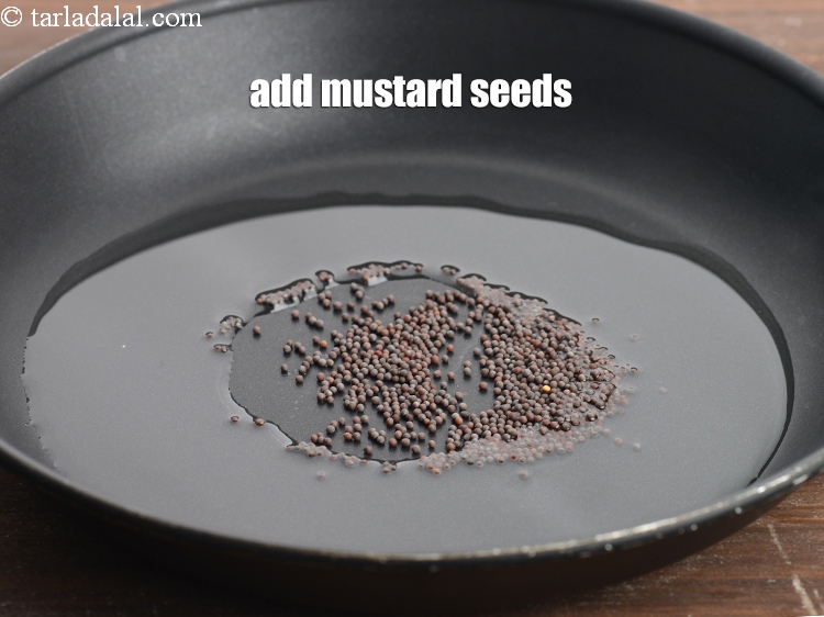 Step 6 – Add 1 tsp <a href="https://www.tarladalal.com/glossary-mustard-seeds-sarson-rai-sarson-ke-beej-525i">mustard seeds ( rai / sarson)</a>.