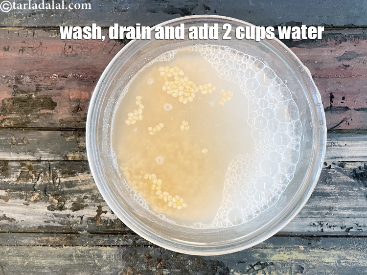 Step 10 – Wash the urad dal. Drain and add 2 cups of water.