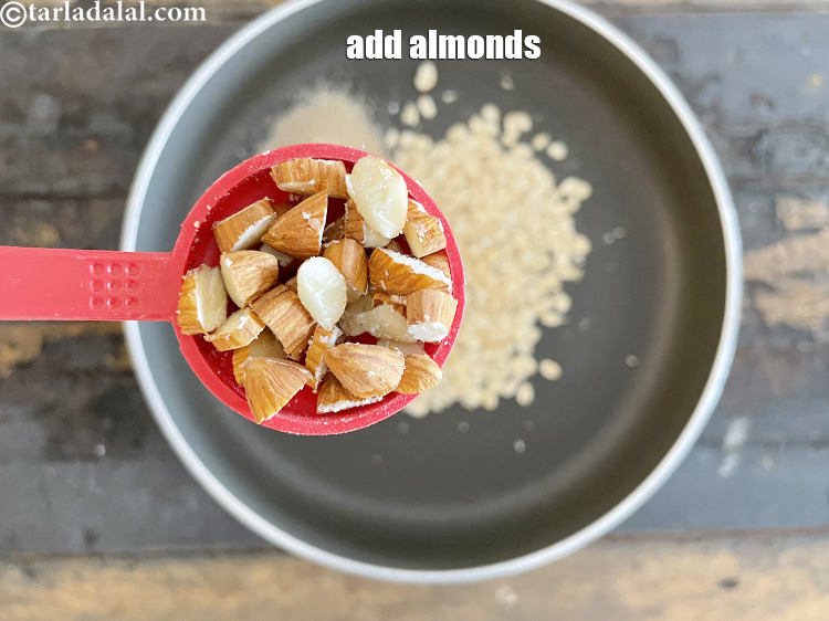 Step 25 – Add&nbsp;1 tbsp&nbsp;<a href="https://www.tarladalal.com/glossary-chopped-almonds-865i">chopped almonds (badam)</a>.