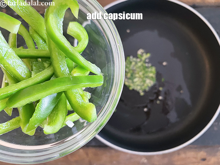 Step 12 – Add&nbsp;<meta charset="UTF-8" />1/4 cup&nbsp;thinly sliced&nbsp;<a href="glossary-capsicum-shimla-mirch-bell-pepper-163i">capsicum</a>.