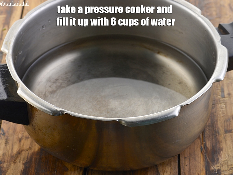 Step 7 – Take a pressure cooker and fill it up with 6 cups of water.