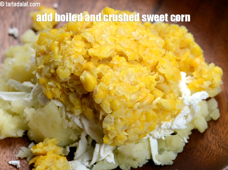 Step 5 – Add &frac12; cup boiled and coarsely <a href="https://www.tarladalal.com/glossary-crushed-sweet-corn-kernels-1605i">crushed sweet corn kernels (makai ke dane)</a>.