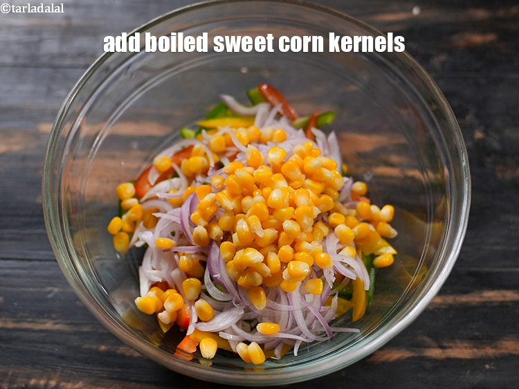 Step 5 – Add 1/4 cup <a href="https://www.tarladalal.com/glossary-boiled-sweet-corn-kernels-153i">boiled sweet corn kernels (makai ke dane)</a>.