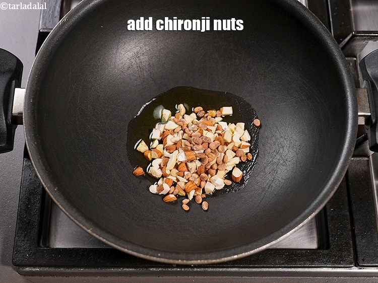 Step 6 – <p>Add 1 tbsp <a href="https://www.tarladalal.com/glossary-chironji-nuts-charoli-piyal-seeds-305i">chironji nuts (charoli)</a>.</p>