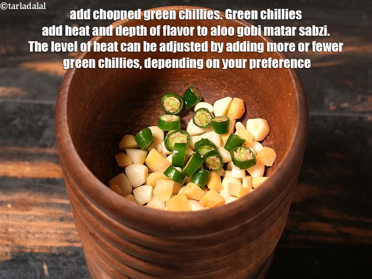 Step 5 – Add 1 tsp <a href="https://www.tarladalal.com/glossary-chopped-green-chilli-820i">chopped green chillies</a>. Green chillies add heat and depth of flavor …