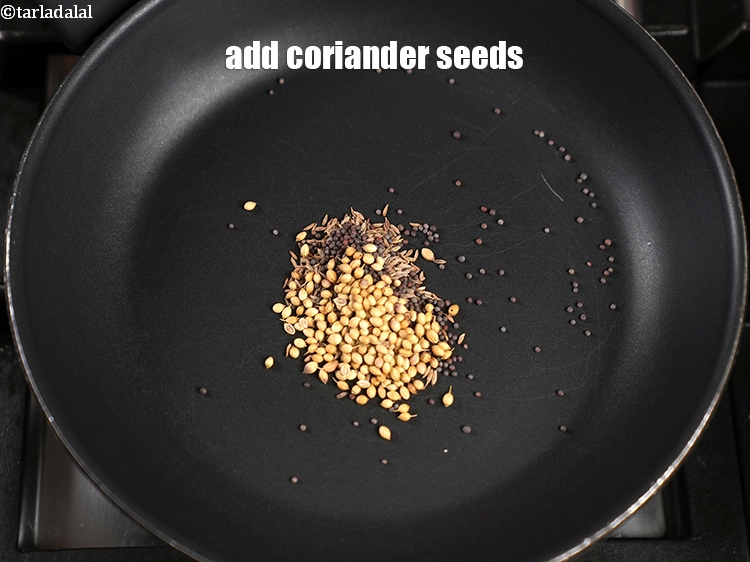Step 5 – Add &frac12; tsp&nbsp;<a href="https://www.tarladalal.com/glossary-coriander-seeds-dhania-ke-beej-dhania-seeds-akha-dhania-371i">coriander (dhania) seeds</a>.