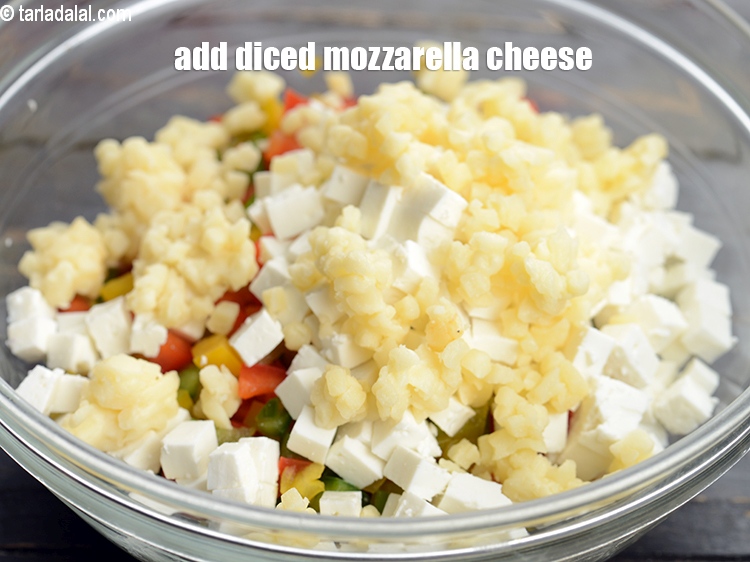 Step 5 – Add &frac14; cup <a href="https://www.tarladalal.com/glossary-diced-mozzarella-cheese-2805i">diced mozzarella cheese</a>.