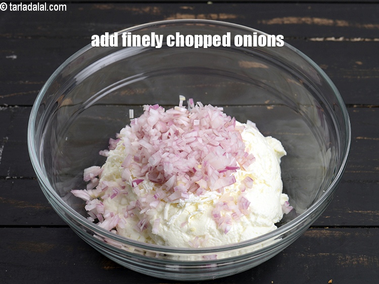 Step 5 – Add &frac14; cup finely <a href="https://www.tarladalal.com/glossary-chopped-onions-722i">chopped onions</a>.