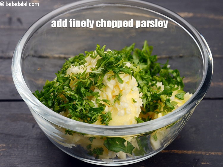 Step 5 – Add 2 tbsp finely <a href="https://www.tarladalal.com/glossary-chopped-parsley-793i">chopped parsley</a>.