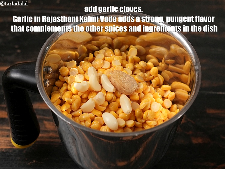 Step 5 – Add 4 to 5 <a href="https://www.tarladalal.com/glossary-garlic-cloves-1857i">garlic (lehsun) cloves</a>. Garlic in Rajasthani Kalmi Vada adds a …