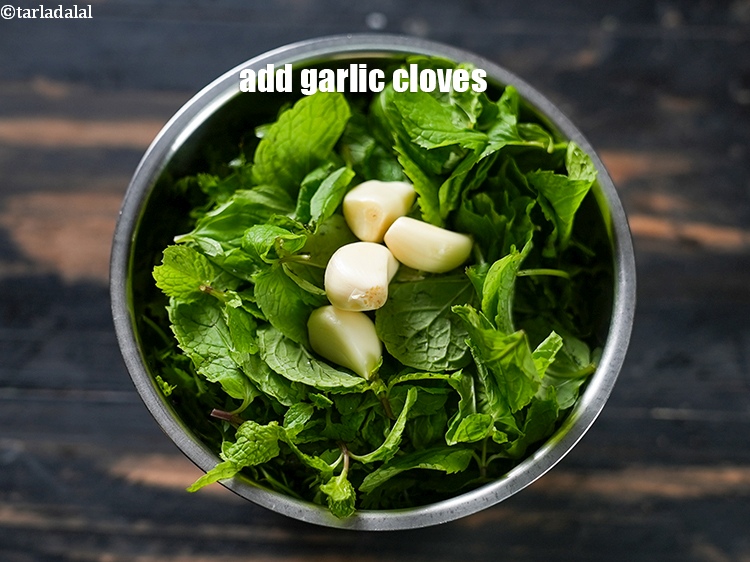 Step 5 – Add 4 <a href="https://www.tarladalal.com/glossary-garlic-cloves-1857i">garlic (lehsun) cloves</a>.
