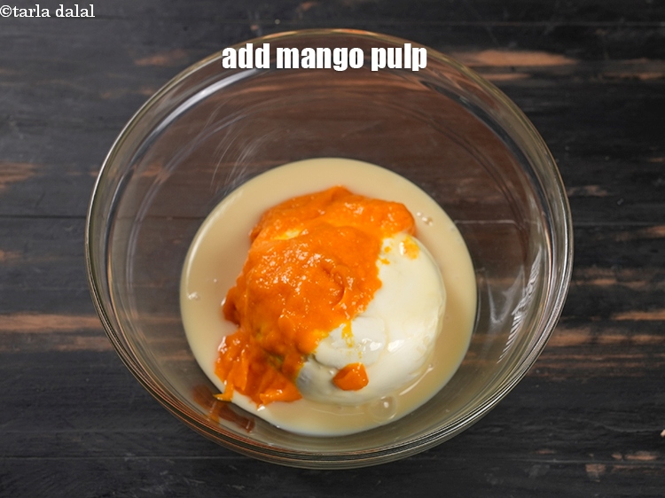Step 5 – Add 1/3 cup <a href="https://www.tarladalal.com/glossary-mango-pulp-aam-ras-amras-146i">mango pulp</a>.