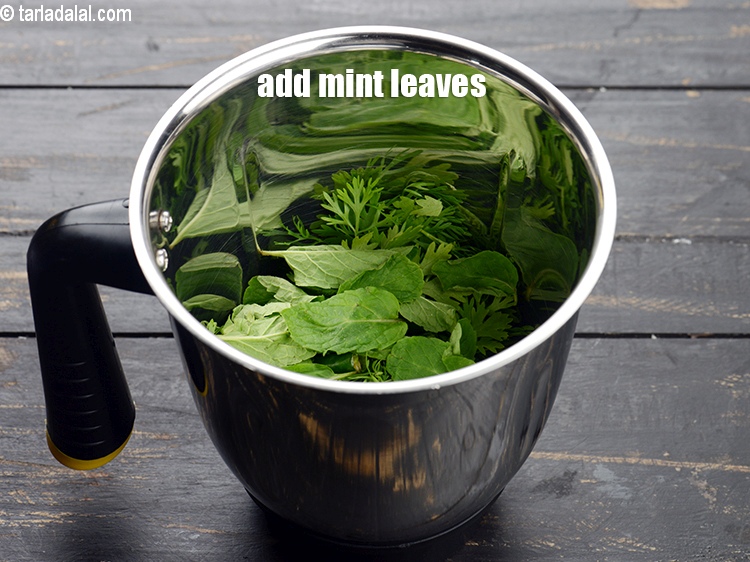 Step 5 – Add 8 to 10 <a href="https://www.tarladalal.com/glossary-mint-leaves-pudina-phudina-521i">mint leaves (pudina)</a>.