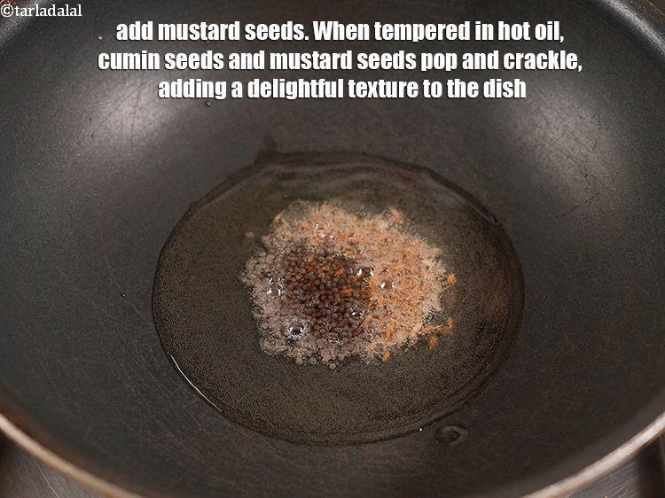 Step 5 – Add &frac12; tsp <a href="https://www.tarladalal.com/glossary-mustard-seeds-sarson-rai-sarson-ke-beej-525i">mustard seeds ( rai / sarson)</a>. When tempered in hot oil, …