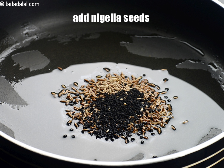 Step 5 – Add &frac12; tsp&nbsp;<a href="https://tarladalal.com/glossary-nigella-seeds-kalonji-onion-seeds-552i">nigella seeds (kalonji)</a>.