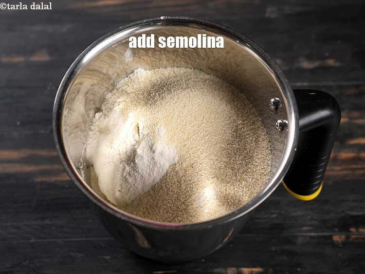 Step 17 – Add &frac14; cup <a href="https://www.tarladalal.com/glossary-semolina-sooji-rava-rawa-603i">semolina (rava / sooji)</a>.