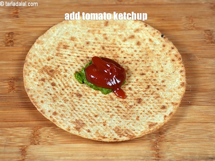 Step 5 – Add &frac12; tbsp <a href="https://www.tarladalal.com/glossary-tomato-ketchup-tomato-sauce-181i">tomato ketchup</a>.