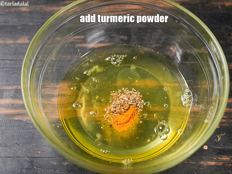 Step 5 – Add &frac14; tsp <a href="https://www.tarladalal.com/glossary-turmeric-powder-haldi-645i">turmeric powder (haldi)</a>.