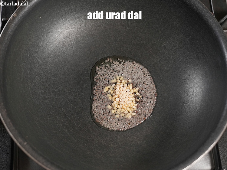 Step 5 – Add &frac12; tsp urad dal.&nbsp;