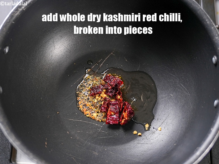 Step 5 – Add 1 <a href="https://www.tarladalal.com/glossary-whole-dry-kashmiri-red-chillies-kashmiri-mirch-kashmiri-lal-mirch-332i">whole dry kashmiri red chilli</a>, broken into pieces.