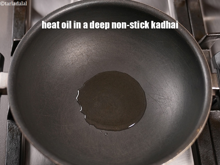 Step 5 – For the tempering, heat 1 tbsp&nbsp;<a href="https://www.tarladalal.com/glossary-oil-671i">oil</a>&nbsp;in a deep non-stick kadhai.