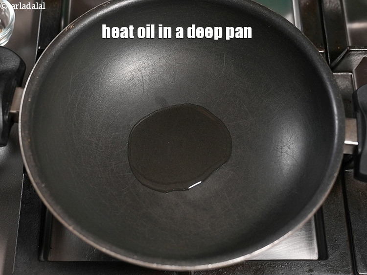 Step 8 – Heat 2 tsp <a href="https://www.tarladalal.com/glossary-oil-671i">oil</a> in a deep pan.