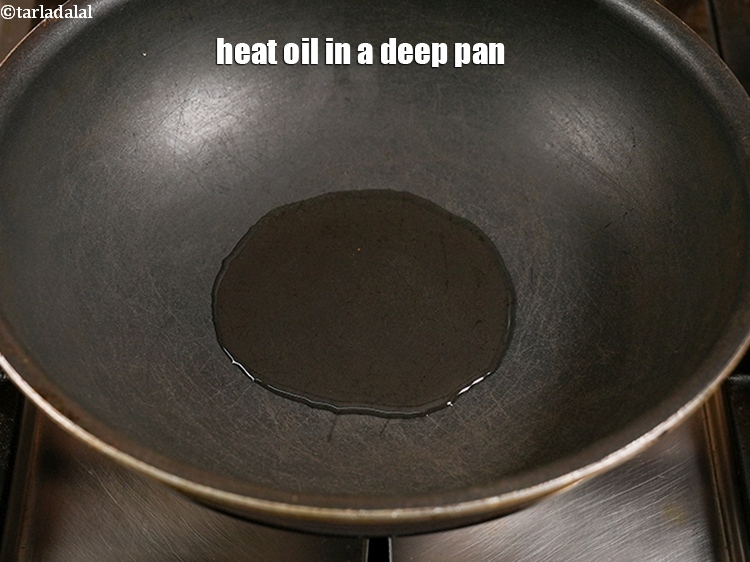Step 5 – Heat 2 tbsp oil in a deep pan.