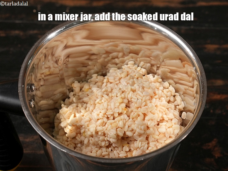 Step 5 – In a mixer jar, add the soaked urad dal.