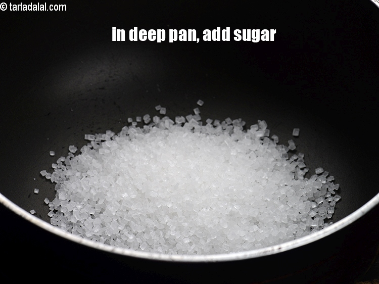 Step 5 – In a deep no-stick pan, add 1/3&nbsp;cup&nbsp;<a href="https://www.tarladalal.com/glossary-sugar-chini-shakkar-278i">sugar</a>.