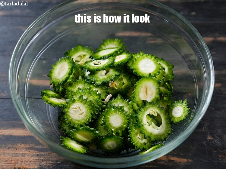 Step 5 – Here we need 2 cups of karela slices. This is how they look.
