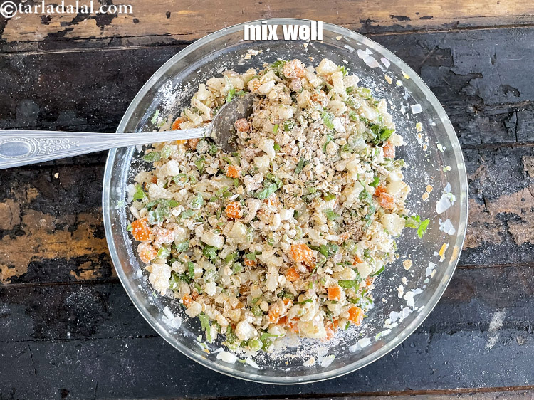 Step 33 – Mix well.&nbsp;Keep aside for 10 minutes. So the oats absorb all the flavours and binds …