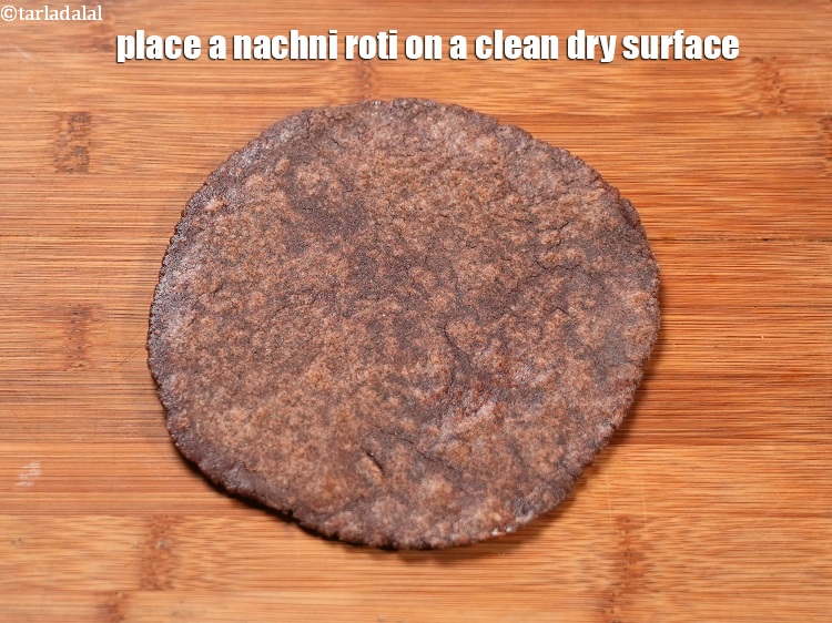 Step 30 – Place a nachni roti on a clean dry surface.
